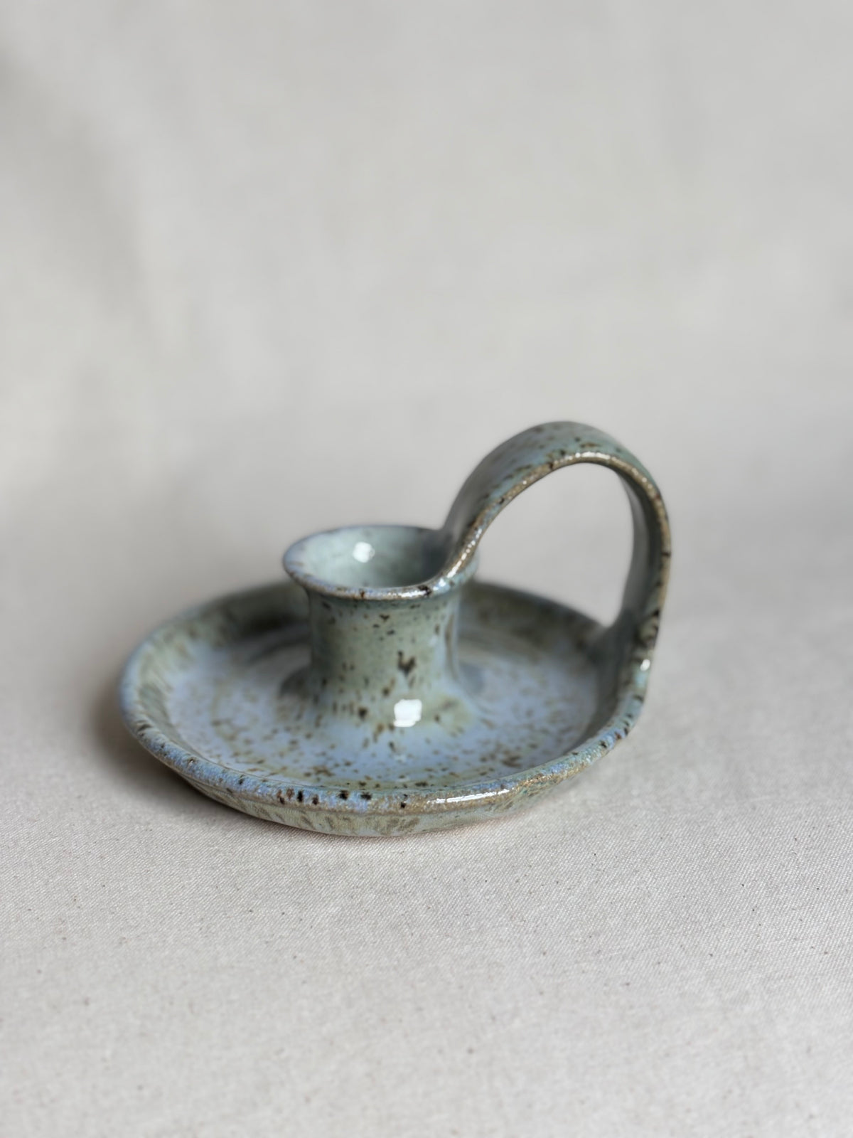 Blue speckled candle holder