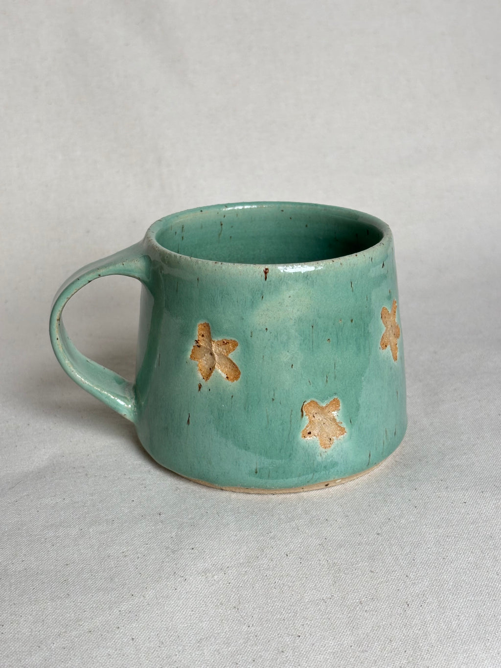 Green speckled flower mug