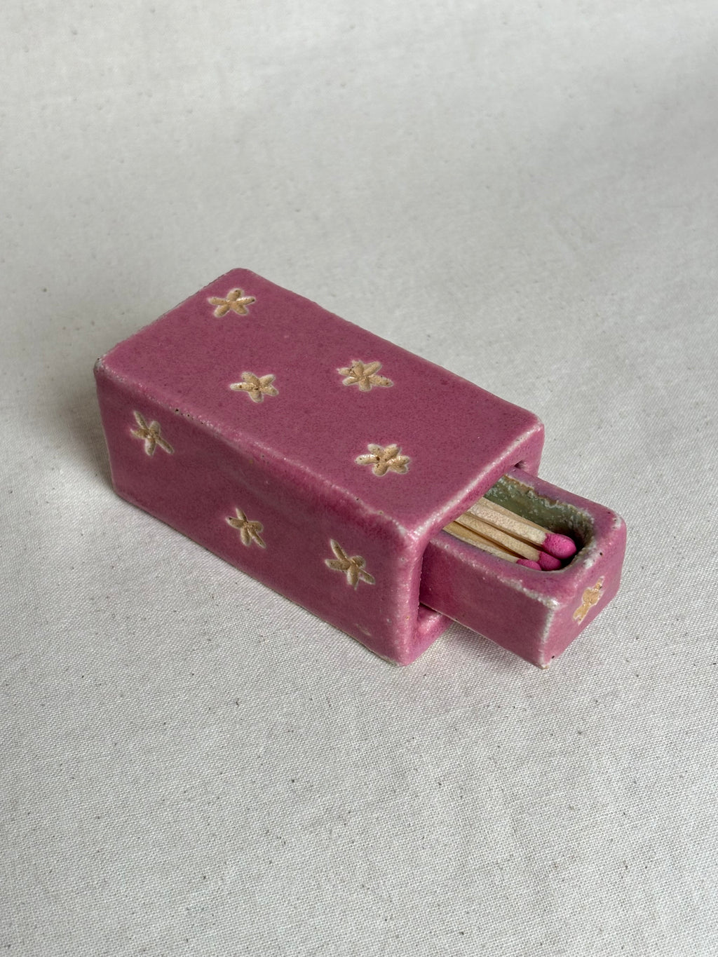 Pink match box with flower detailing